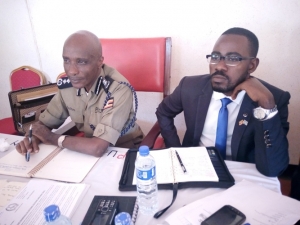 Kayihura with Katabi Town Council LC3 Chairman Ronald Kalema during the meeting at the Council hall on Tuesday.