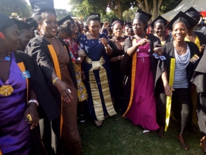 Minister Sseninde surrounded by Sseninde foundation graduands during the thanks giving party.