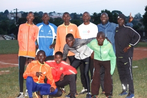 Coach Moses Asonya (in white) poses for a team photo with the Athletes in Entebbe. He will lead Team Uganda at the U-18 Athletics Championships.