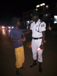 Entebbe OC Traffic Eriya Kamugisha arrests a drunk driver during a drink driving swoop on Friday night.