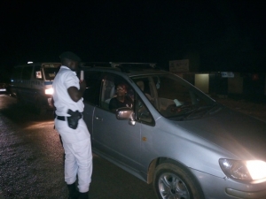 Entebbe OC Traffic Eriya Kamugisha conducting a crackdown on drunk drivers on Friday night.