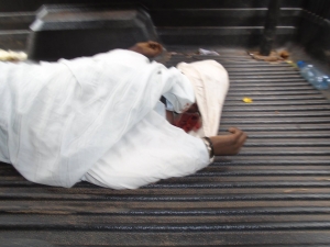 Aisha Kasowole's body on a police pick up.