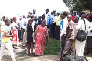 MP Tumusiime at the Bugonga Landing site with fishermen. She warned them against illegal fishing.