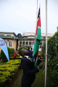 Team Kenya Captain Alfred Nandwa raises the Kenyan Flag during the flag raising Ceremony. Photo Credit Timothy Okiror (Studio 25)