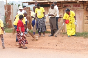 Hon. Rose Tumusiime with other NRM Leaders during a cleaning exercise in Nsamizi on Thursday.