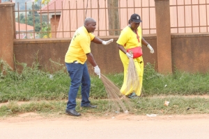 Hon. Tumusiime with NRM Vice Chairman (Entebbe) during a cleaning exercise in Nsamizi.