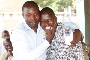 LC3 Councilor Bawonga Kasawuli (Left) and Mugerere Ronald hug each other after the elections.