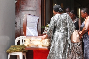 Mourners view Late Jackie Ochieng's body at St. John's Church where a service was held on Monday.