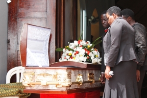 Mourners view Late Jackie Ochieng's body at St. John's Church.