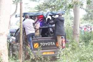Police pick up storms away from the scene with the body of the deceased.