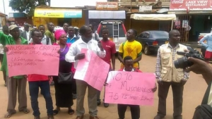 Bawonga (middle) led the demos in Entebbe on Wednesday.