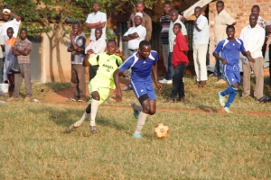 Ludo's Jonathan Wamala dribbles past Mapeera Young player in the group stages match. Ludo won 6-3.