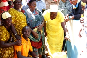 MP Tumusiime with Katabi Busambaga leaders during the launch of the public stand pipes on Saturday.