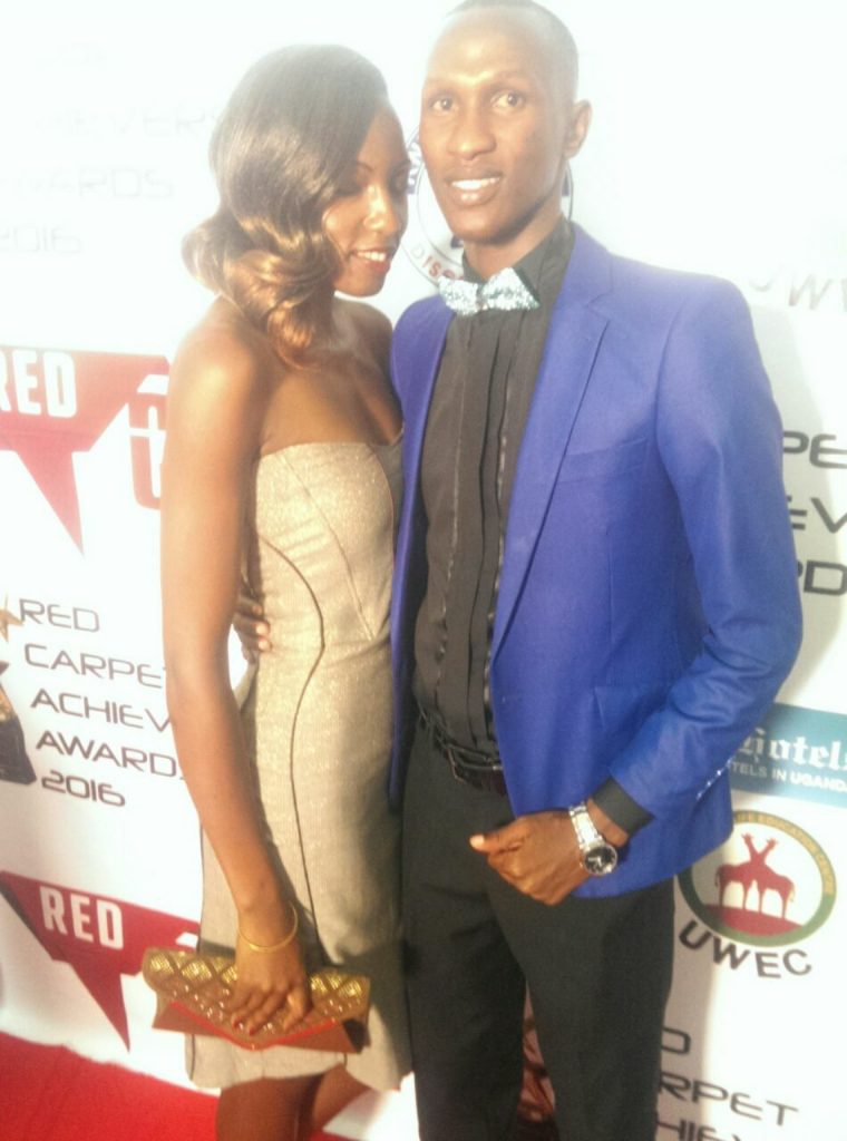 Bamweyana Muyomba squeezes Councilor Faridah tight at the Red Carpet function.
