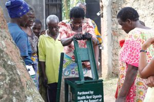 Older Persons In Bugonga Learn how to use a briquette Machine.