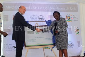 State Minister for Health (General Duties) Hon. Sarah Opendi (R) and the British High Commissioner to Uganda Amb. Peter West officially launch the MRC/UVRI and LSHTM on Friday.