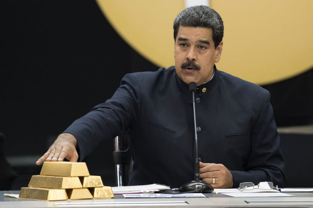  Venezuelan President Nicolás Maduro with gold ingots at a 2018 cryptocurrency conference in Caracas. Photo: Carlos Becerra/Bloomberg News 