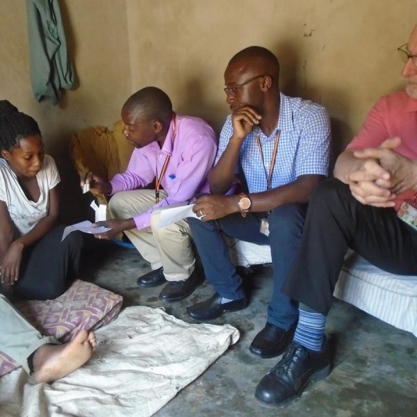YBH team member explains the prescribed medication to the main carer of a returned family member
