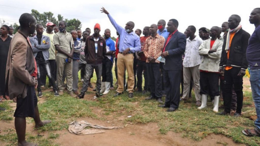 Entebbe deputy mayor Richard Ssekyondo (blue shirt) addresses fishermen, who vowed not to vacate the disputed land at Kigungu Landing Site in Entebbe Municipality. PHOTO / EVE MUGANGA