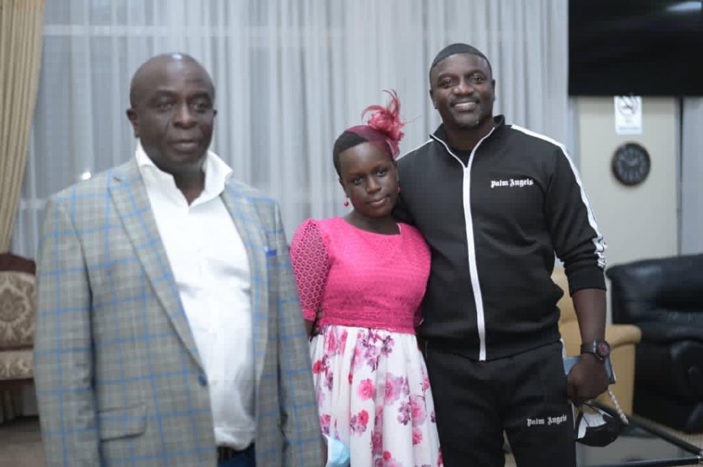 Amb.Abbey Walusimbi(L) in a photo moment with Akon.