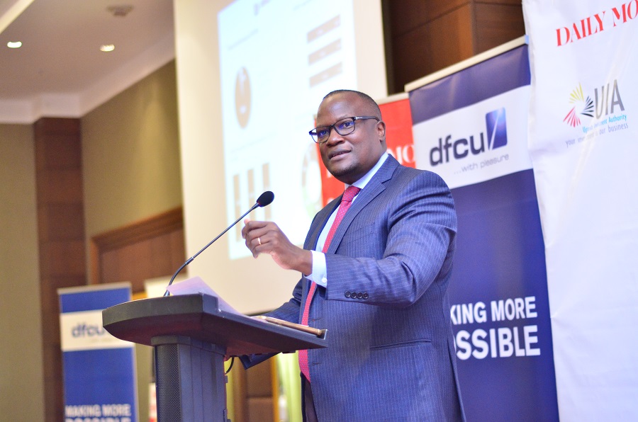 Mathias Katamba, dfcu Bank's CEO addresses guests during the launch of The 2021 Uganda Top 100 mid-sized companies’ survey .