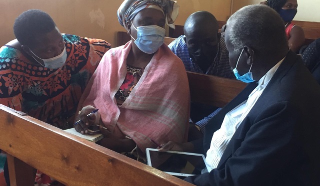 Court orders sureties of murder suspect Kirabo to pay UGX 150M L-R, The sureties Elizabeth Baleke, Imelda Wabulembo, Benard Mbayo talk to their lawyer Charles Dalton Opwonya in court. URN photo