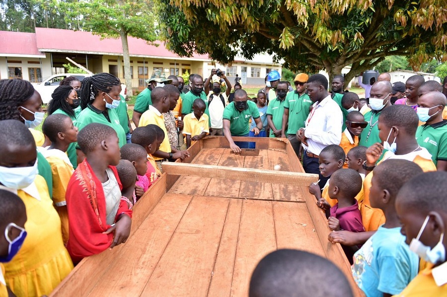 Bank staff play a game of woodball with the visually impaired children
