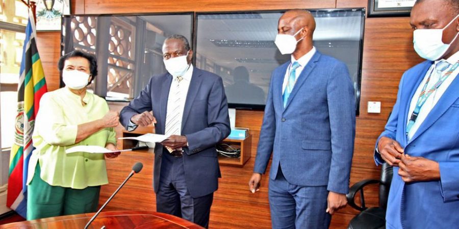 New twist as Solicitor General distances self from coffee deal Finance minister Matia Kasaija (2nd left) exchanges documents with Ms Enrica Pinetti (left) after signing an agreement with the Finance ministry to establish a coffee processing plant in Uganda, on February 10. PHOTO/File