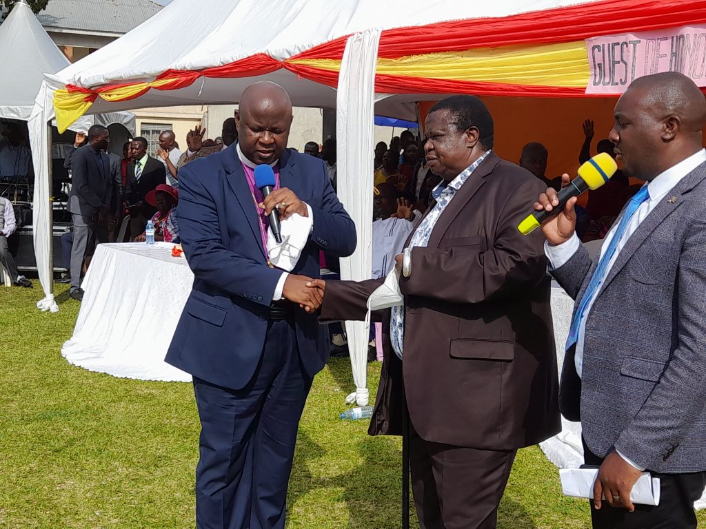 Internal Affairs minister, Maj Gen Kahinda Otafiire (centre) welcomed to address the public during the thanksgiving ceremony of Mr Don Tumusiime, a leader of Bushenyi Town Temple Pentecostal Church, on Saturday. PHOTO | MILTON BANDIHO