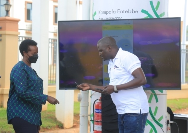 URA partners with MTN on toll payment along the Kampala-Entebbe Expressway UNRA ED Allen Kagina having her upeesi card topped up at the Kajjansi toll stop on the Entebbe Express Highway (PHOTO /Courtesy)