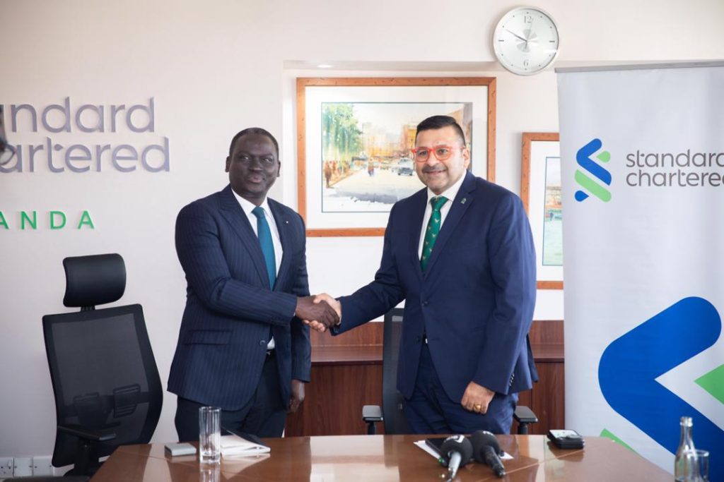 Kin Kariisa with Stanchart CEO Sanjay Rughani