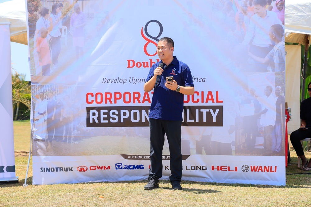 Lin Yu, Managing Director of Double Q, speaking during their CSR events where they extended educational support to 35 school-going children from more than 20 schools in Kalungu District, to help vulnerable children remain in school and pursue their educational aspirations. COURTESY PHOTO